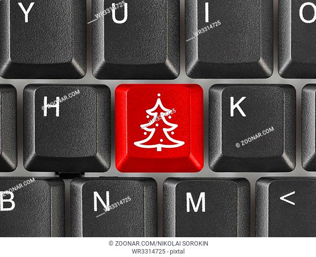 Computer keyboard with Christmas tree key - holiday concept