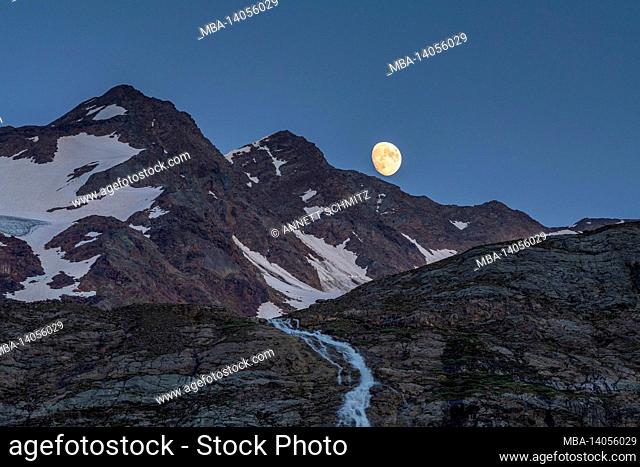 moon rise behind the venetian peaks in south tyrol
