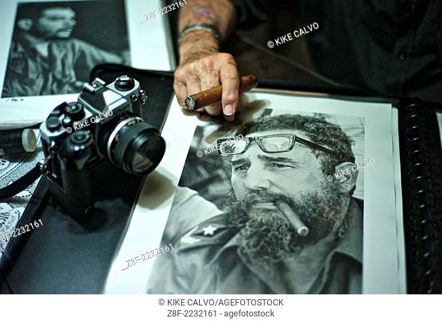 Cuban photographer Liborio Noval (1936-2012), holding a photograph of Fidel Castro smoking a cigar, was one of the most iconic photographers of the Cuban...