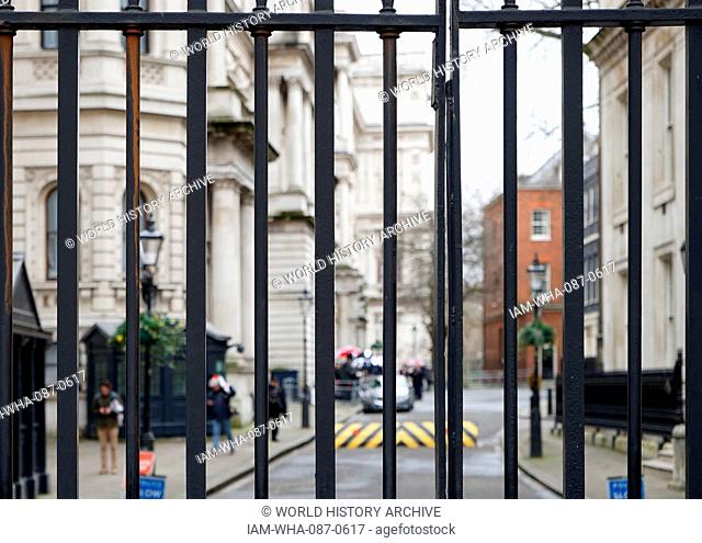 Security gates with raised road ramp at the entrance to Downing Street London. Downing Street is the home to the Chancellor of the Exchequer and the British...