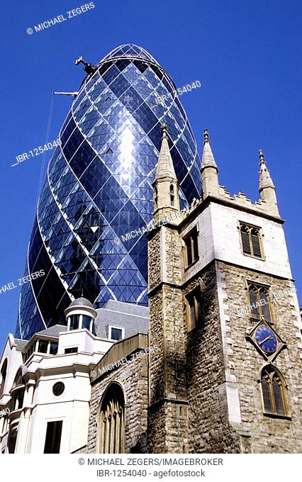 Futuristic Swiss Re Tower, The Gherkin Tower designed by architect Norman Foster, behind the Church of St. Helen, Bishopsgate, City Of London, London, England