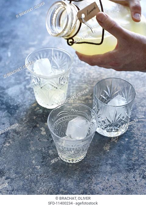Lemonade being poured into glasses