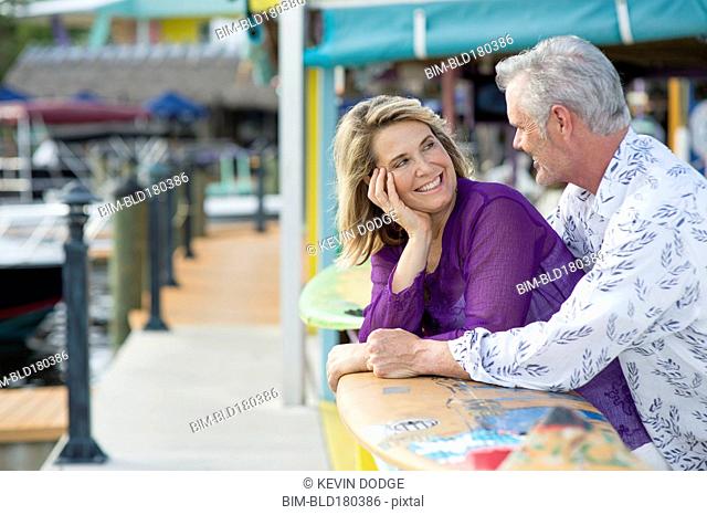 Older Caucasian couple smiling outdoors