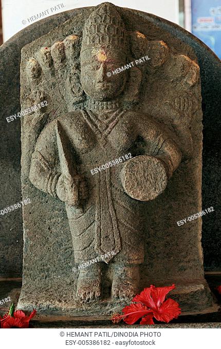 Navsira village deity with nine heads circa in eighteenth century AD in Panhale Kazi caves ; Konkan ; Maharashtra ; India