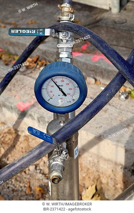 Gas pipe with a manometer on a construction site, renewal of supply lines, Im Telgei street, Dortmund, Ruhr area, North Rhine-Westphalia, Germany, Europe