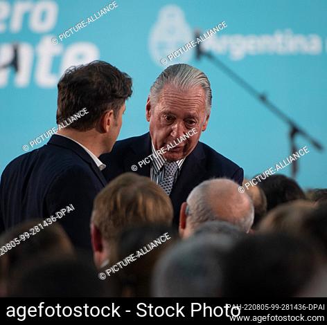 03 August 2022, Argentina, Buenos Aires: Axel Kicillof (l), governor of Buenos Aires province, talks with Daniel Funes de Rioja (r)