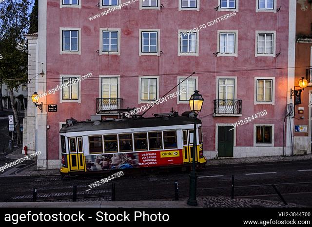 Tram in Alfama streets, Lisbon (Portugal)