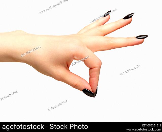 Female hand with black nails manicure. Isolated on white background