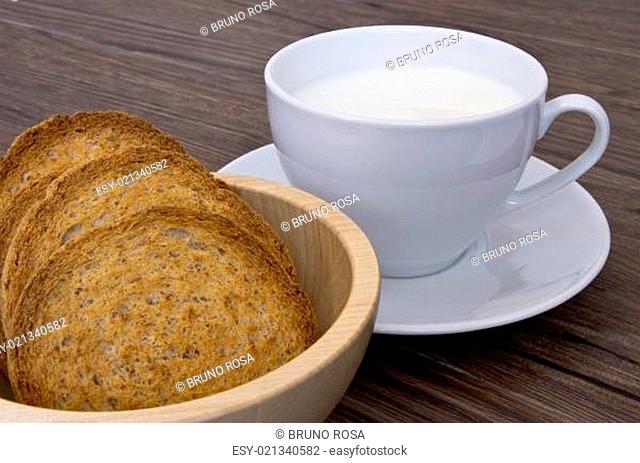 A cup of milk with rusks