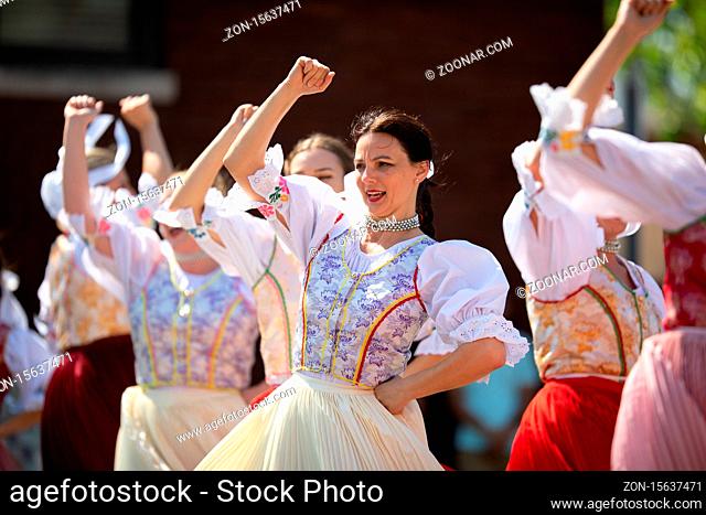 Whiting, Indiana, USA - July 27, 2019: Pierogi Fest, Slovakian women wearing traditional clothing dancing among themselves