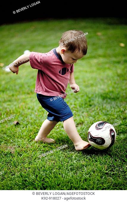 Boy kicking a soccer ball