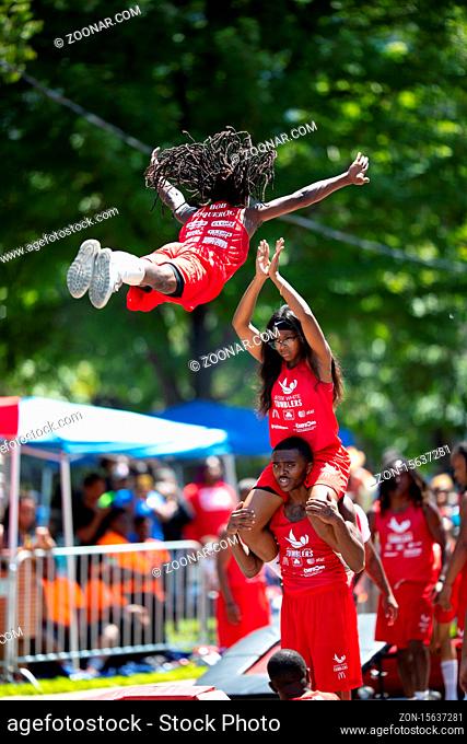Chicago, Illinois, USA - August 8, 2019: The Bud Billiken Parade, Members of the Jesse White Tumbling Team performing at the parade
