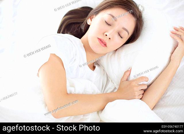 besutiful Young woman sleeping in bed at home