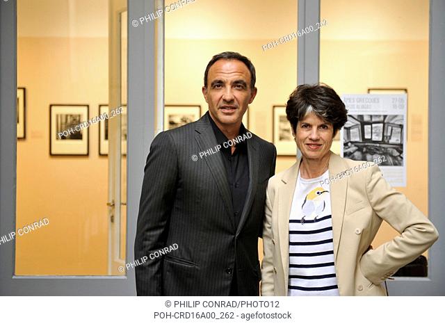 Nikos Aliagas, French-Greek journalist, entertainer and photographer, with Valérie-Anne Giscard d'Estaing, director of Galerie Photo12