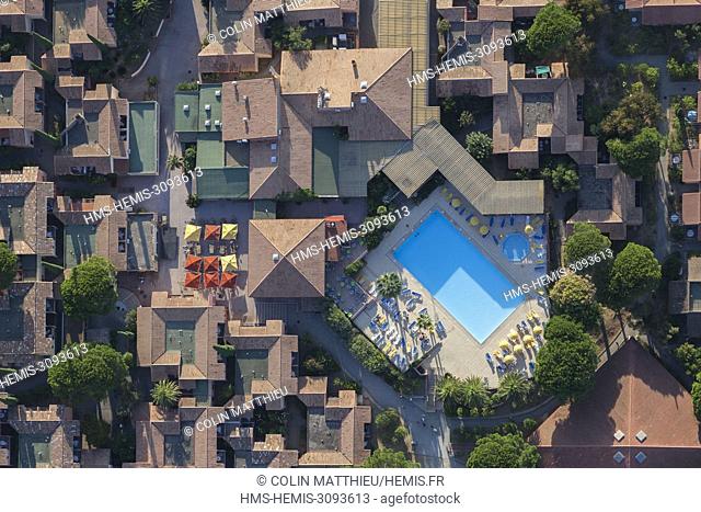 France, Var, Saint Tropez peninsula, Ramatuelle, Pampelonne beaches, Ramatuelle Holiday Village, swimming pool (aerial view)