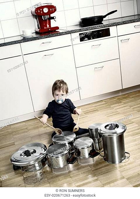 Playing drums with pots and pans