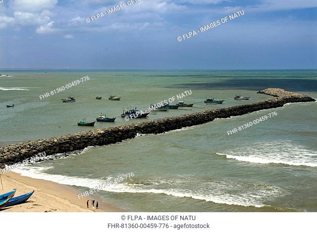 View of breakwater with moored fishing boats, confluence of Indian Ocean, Arabian Sea and Bay of Bengal, Kanyakumari Cape Comorin, Tamil Nadu, India