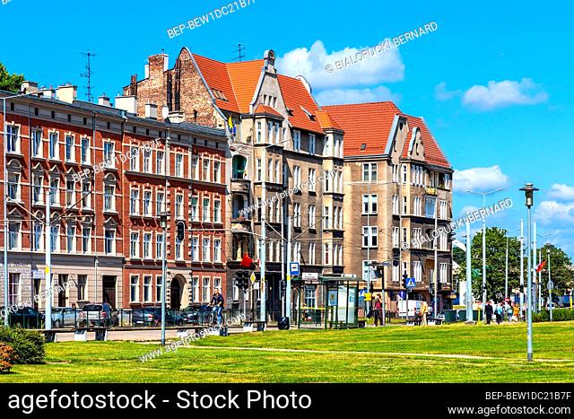 Gdansk, Pomerania / Poland - 2020/07/14: Solidarnosci square and surrounding tenement houses in old Gdansk Shipyard quarter in front of European Solidarity...