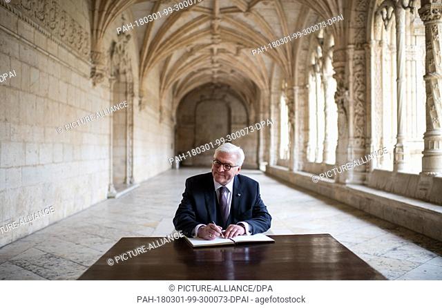 01 March 2018, Portugal, Lisbon: German President Steinmeier sign the guest book after viewing the church and the Hieronymite Cloister by museum director Isabel...