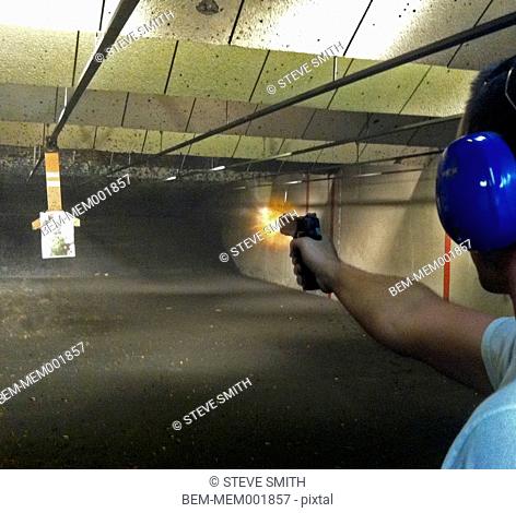 Man shooting gun in range