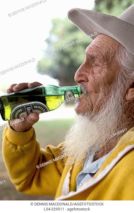 Old man drinking beer