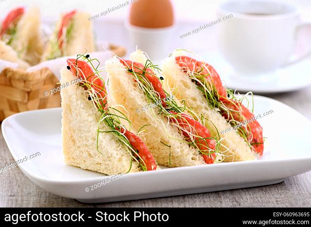 Wheat toast sandwich with cream cheese with microgreen onion sprouts and salami. Healthy and fresh food