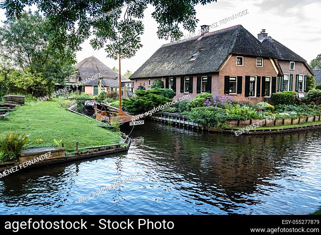 Giethoorn, Netherlands - August 5, 2016: The village Giethoorn is unique in the Netherlands because of its bridges, waterways and typical boats calle punters