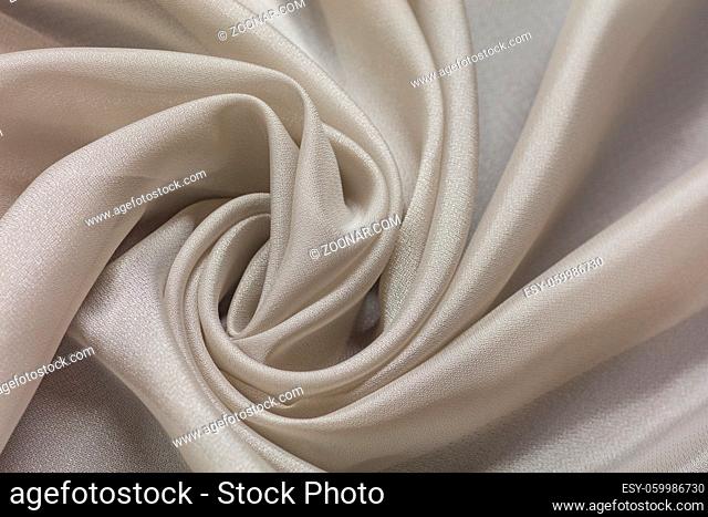 Shiny cloth background with white vial textile multiple curls