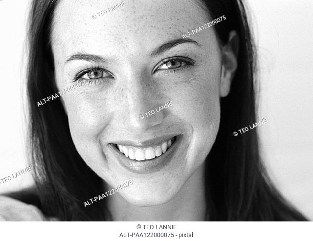 Woman smiling, close-up, b&w, portrait