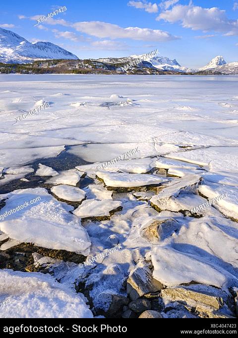 Landscape at the frozen Salangen Fjord near Skarvika in northern Norway during winter. Europe, northern europe, Norway