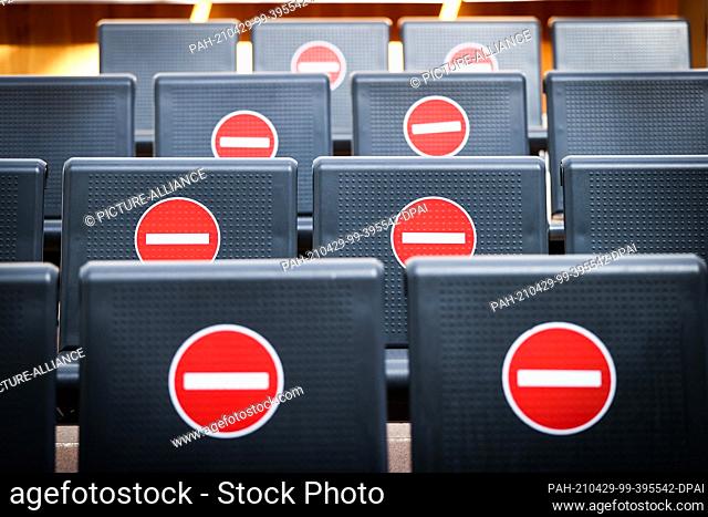 27 April 2021, Hamburg: Individual seats are blocked with stickers in the waiting area in Terminal 1 at Hamburg Airport. Only around ten percent of the usual...
