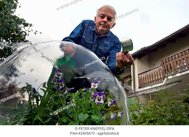 Inventor Bruno Gruber holds his waterring can with a non-blocking spicket in Olching, Germany, 15 October 2013. For 35 years