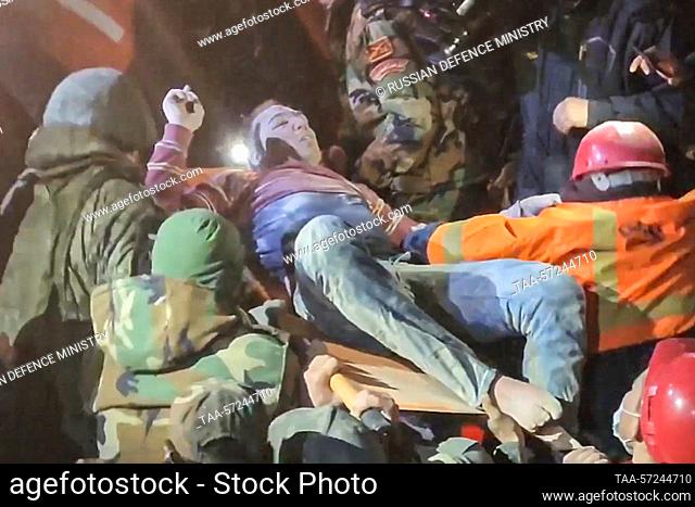SYRIAN ARAB REPUBLIC, ALEPPO - FEBRUARY 8, 2023: Russian military police officers rescue a local man who has been trapped under the rubble for several days with...