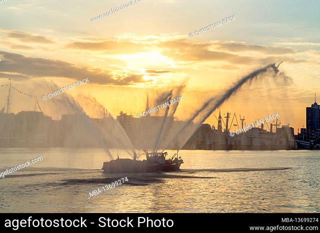 Fire department boat on the morning of the Hamburg Harbor Birthday, view of HafenCity, Hamburg, Germany
