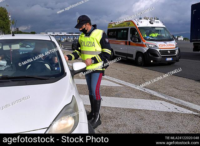 The police carry out checks on people on the highway. Prime Minister Giuseppe Conte's government has announced restrictions that put Italy in some form of...