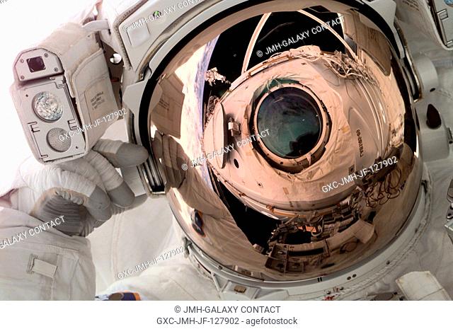 Astronaut Scott E. Parazynski, mission specialist, was photographed with a digital still camera by one of the Expedition Two crew members aboard the...