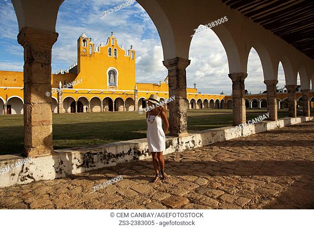 Woman posing at Izamal convent, Monastery-Convent Of San Antonio De Padua, Izamal, Yucatan, Yucatan Province, Mexico, Central America