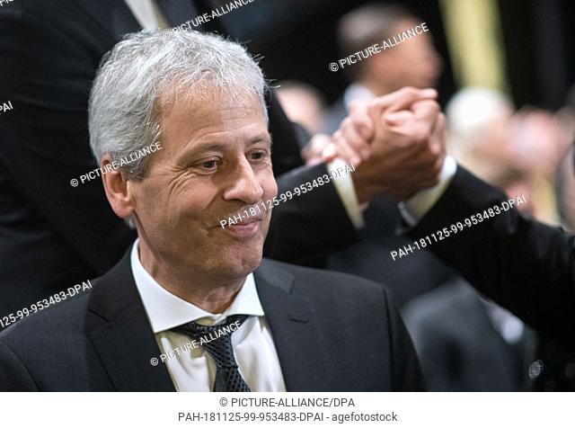 25 November 2018, North Rhine-Westphalia, Dortmund: Coach Lucien Favre sits at the general meeting of Borussia Dortmund in the audience
