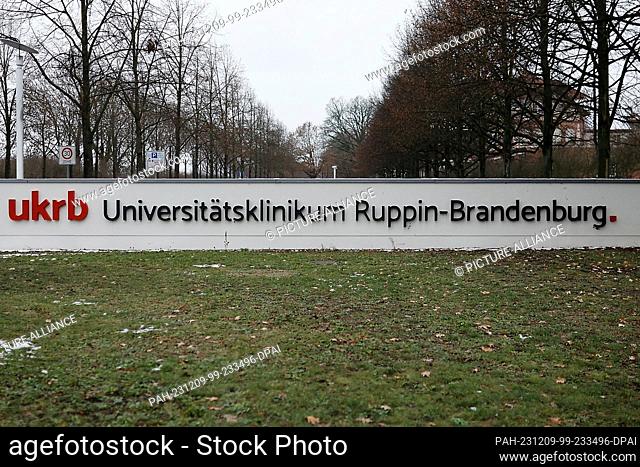 PRODUCTION - 08 December 2023, Brandenburg, Neuruppin: The name of the University Hospital Ruppin-Brandenburg is written on a pawn