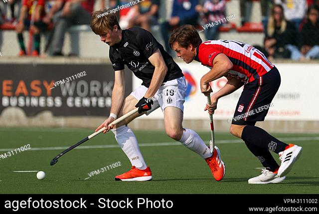Racing's Hippolyte Delavignette and Leopold's Tom Boon fight for the ball during a hockey game between Royal Leopold Club and Royal Racing Club de Bruxelles