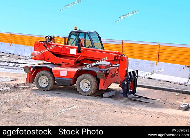 Big Forklift Truck With Long Boom at Construction Site