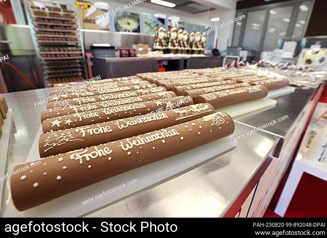 17 August 2023, Thuringia, Schmalkalden: ""Merry Christmas"" is written on nougat sticks in Viba's production. Viba is a medium-sized confectionery company from...