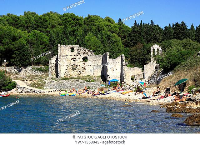 People on a beach at Bijar Bay in Osor, Croatia
