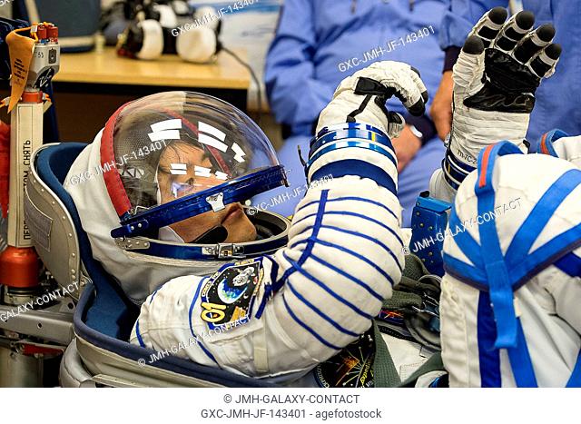 In the Integration Facility at the Baikonur Cosmodrome in Kazakhstan, Expedition 48-49 crewmember Takuya Onishi of the Japan Aerospace Exploration Agency...