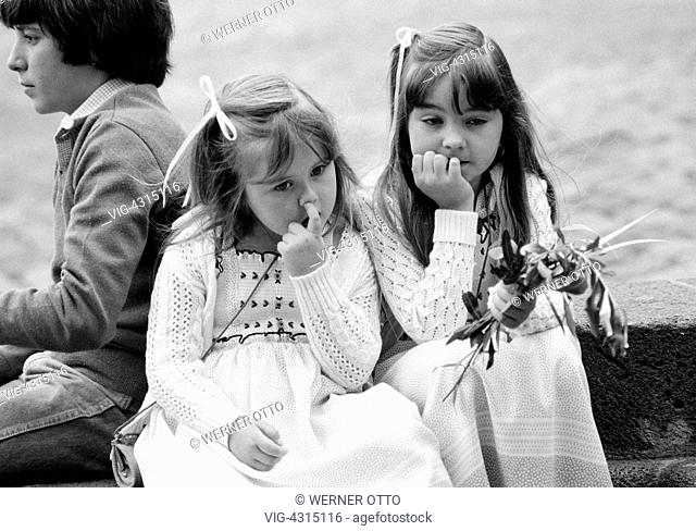Eighties, black and white photo, Easter, Passion Week, Palm Sunday 1981, church parade, little girl holds palm branches in the hand