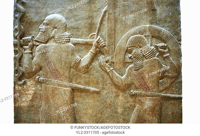Stone relief sculptured panel of soldiers carrying a war chariot . Facade L. Inv AO 19884 from Dur Sharrukin the palace of Assyrian king Sargon II at Khorsabad