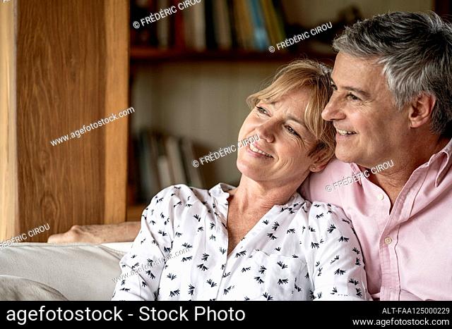 Senior couple relaxing in stilt hut