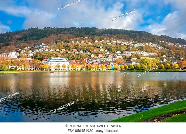 Houses on the shore of small Lille Lungegardsvannet lake, also called Smalungeren, in autumn, Bergen, Norway