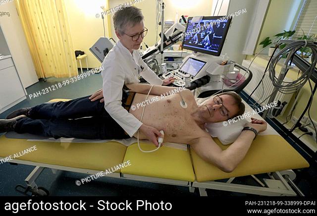 18 December 2023, Mecklenburg-Western Pomerania, Pasewalk: Christine Bahr, a cardiologist, examines a patient in her practice at a press event to mark the...