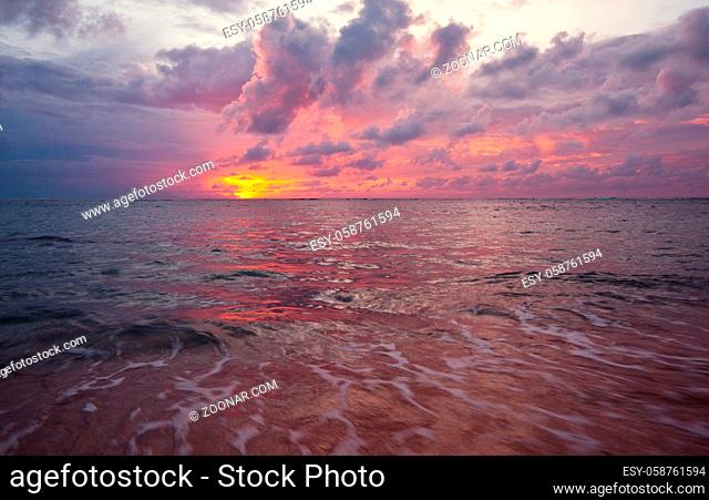 Scenic colorful sunset at the sea coast. Good for wallpaper or background image